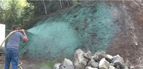 Spraying hydroseed slurry from a hose